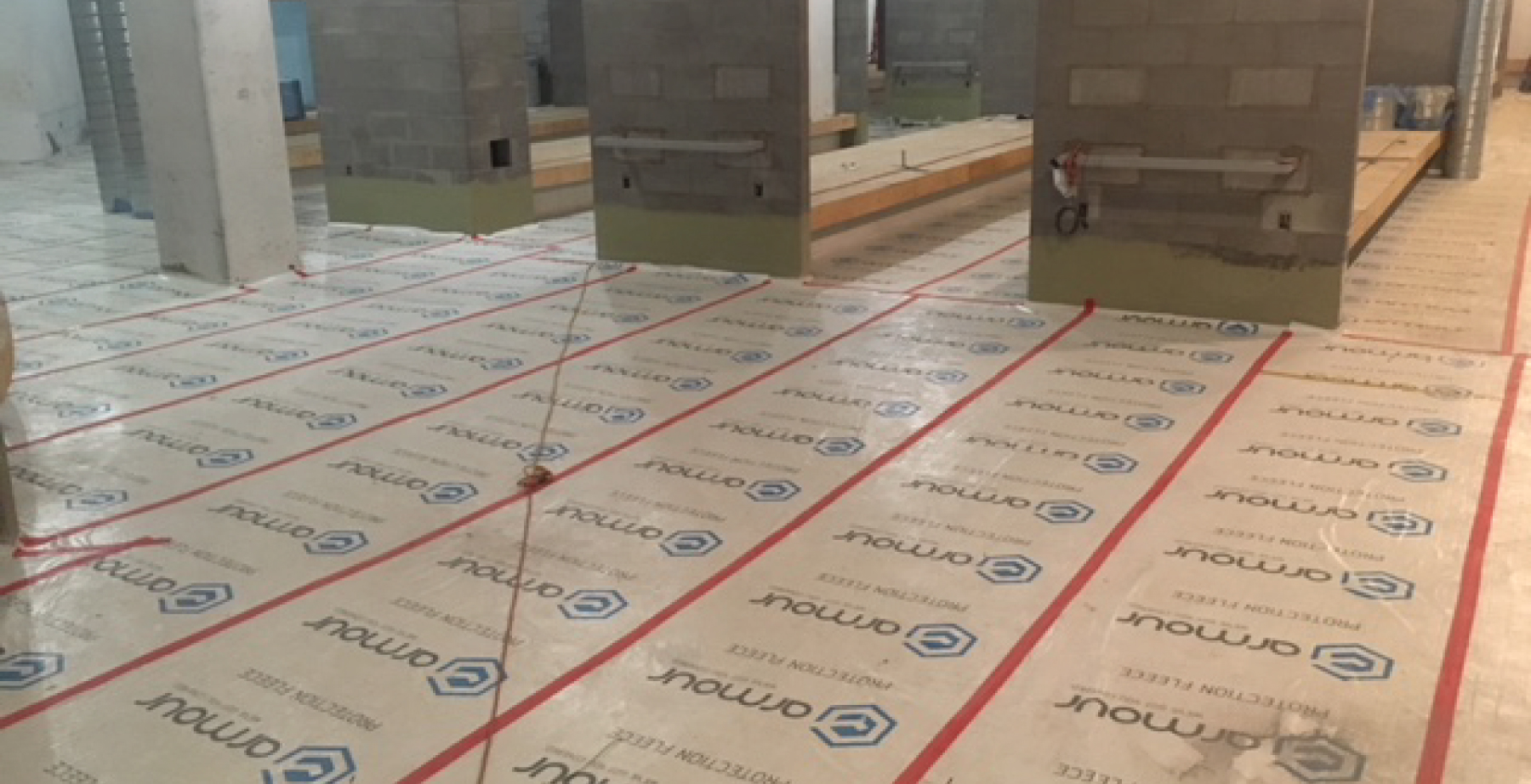 Image of Armour Protection Fleece on floors for Bird Construction/ Brookfield Residential YMCA at Seton case study blog by Axiom, supplier to Canada/ North America construction professionals