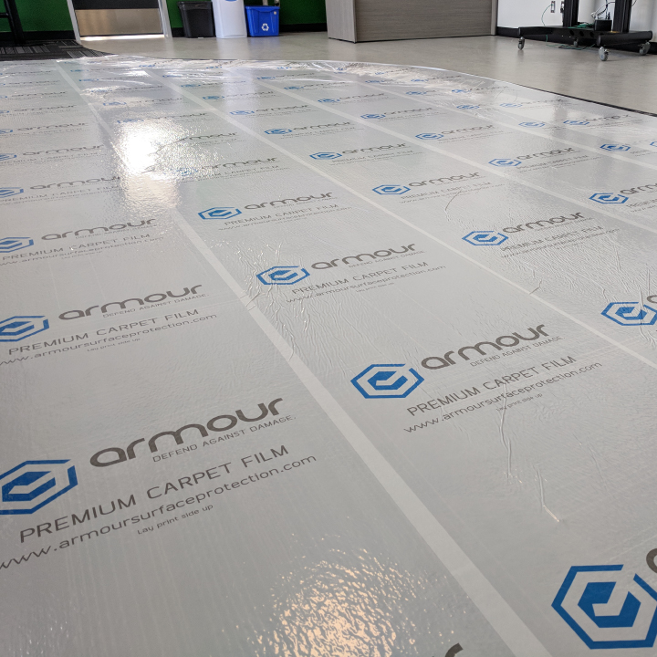 Image of Armour Premium Carpet Film on commercial carpet for jobsite carpet protection blog by Axiom, jobsite surface protection supplier to Canada/ North America construction professionals