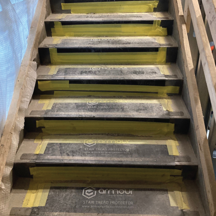 6 Ways To Properly Protect Stairs During A Construction Project  - Armour Stair Tread Protector On Jobsite